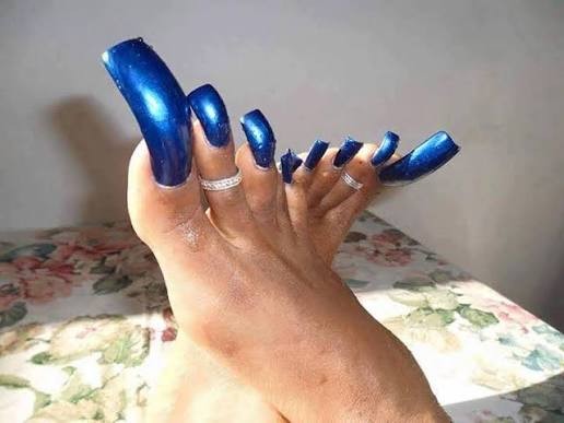 Long metallic blue toenails — nail biter