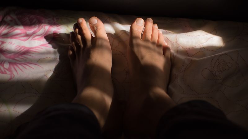 College-era feet with questionable nail choices